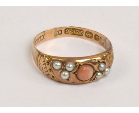 A 9ct rose gold ring set with central coral cabochon, flanked by pearl sprays, band decorated with etched pattern, size O, ap