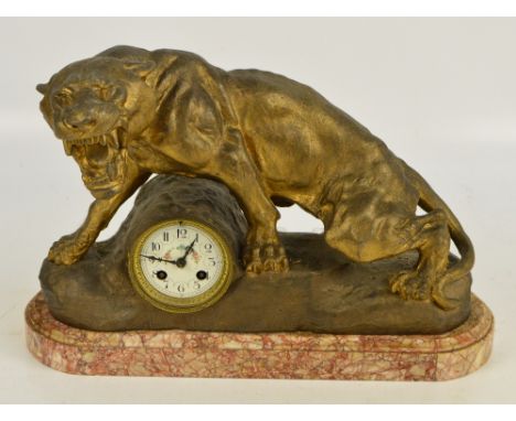 A late 19th/early 20th century French gilt spelter panther eight day mantel clock, the circular dial set with Arabic numerals