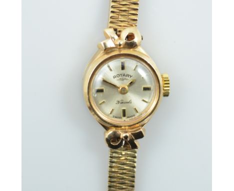 ROTARY; a 1960s 9ct yellow gold manual wind lady's wristwatch, the circular dial set with baton numerals, on gold textured br