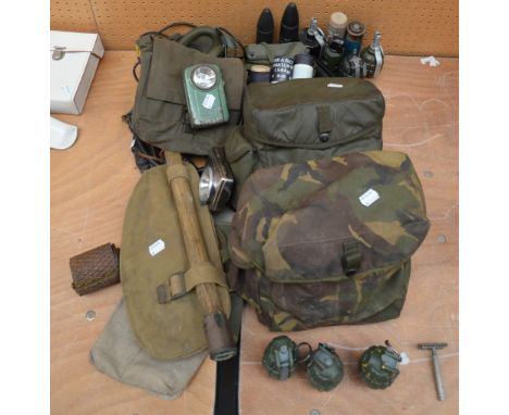 A quantity of 20th century military equipment including a pick axe, gas masks, grenades, comms equipment, etc.