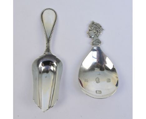 MAPPIN & WEBB; a Queen Elizabeth II Jubilee hallmarked silver caddy spoon decorated with a profile of her head, Birmingham 19