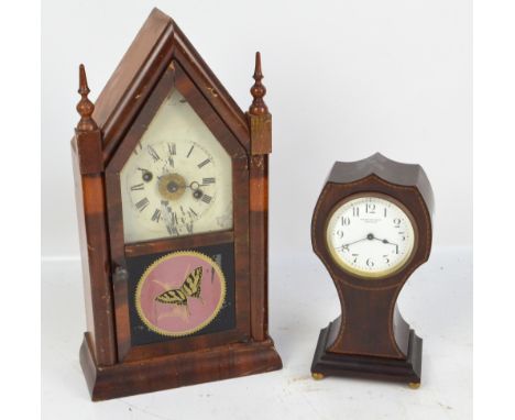 An Edwardian mahogany and line inlaid mantel timepiece, the circular white enamel dial inscribed 'Woodmansy & Son, Doncaster'