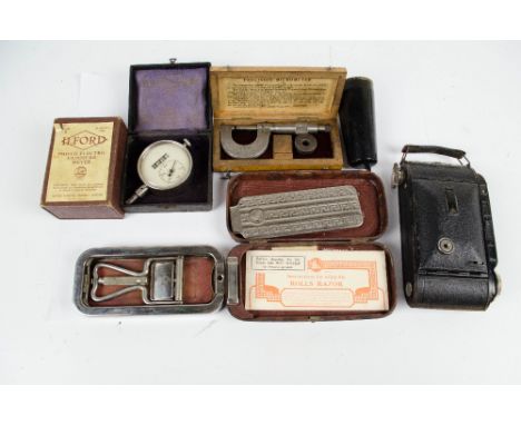 A collection of scientific instruments comprising a boxed precision micrometer, engraved 'AER', a boxed 'System' revolution c