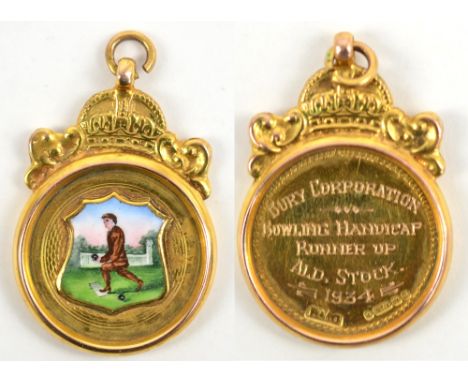 A 9ct yellow gold bowling medallion fob with shield shaped enamel image of a bowler below a crown, with presentation inscript