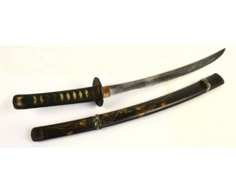 A Japanese wakizashi with shagreen bound grip and pierced iron tsuba, length of blade 43cm, in decorated lacquered scabbard.