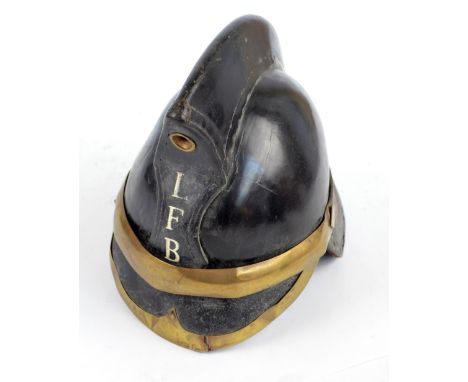 A c.1900 Liverpool Fire Brigade leather helmet with brass trim, raised comb and inscribed to the front 'LFB' and to the inter