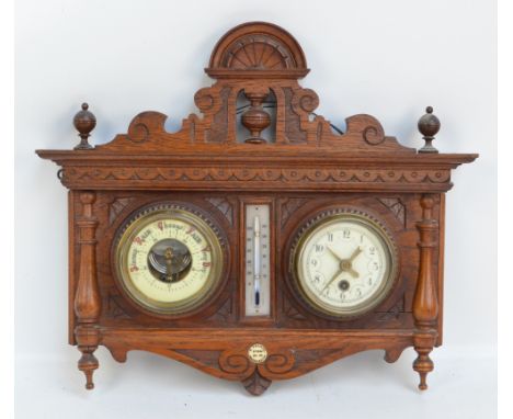 An early 20th century carved oak wall mounted clock barometer and thermometer, bearing ivorine plaque inscribed 'A. Franks, M