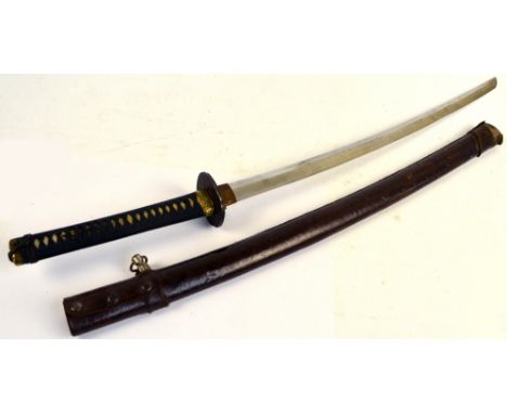 A Japanese katana with shagreen bound grip, iron tsuba, length of blade 66cm, in leather clad scabbard.