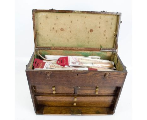 An oak cased tool cabinet containing various Robert Sorby gauges and tools.