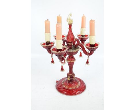 A Venetian ruby glass electric five branch candelabrum, with clear glass scallop decoration, each branch with ring lustre and