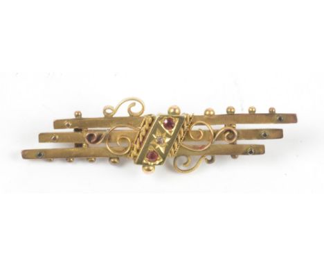 A 9ct gold ruby set bar brooch, width 4.5cm, approx 3.1g.