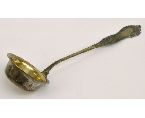 A post 1888 German silver soup ladle with cast floral and foliate scroll decorated finial with traces of initials, the circul