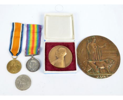 A bronze WWI remembrance plaque awarded to William Spencer, two WWI medals awarded to 50788 PTE.J.A.RIDGWAY.LAN.FUS and a box