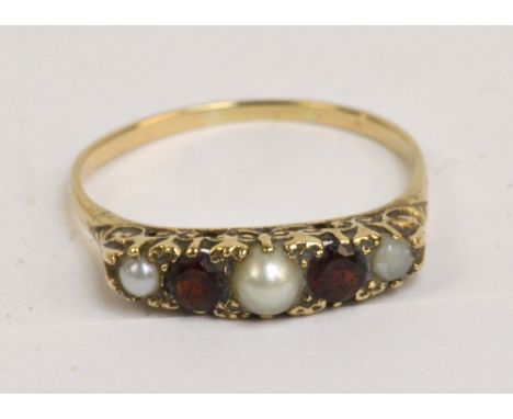 A 9ct yellow gold ring set with three pearls, the central pearl flanked by garnets, size U 1/2, approx 2.7g.   CONDITION REPO