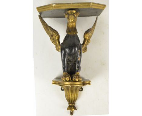 A 19th century gilt and ebonised wall bracket modelled as a seated griffin, width 30cm (af).   CONDITION REPORT:  Several are