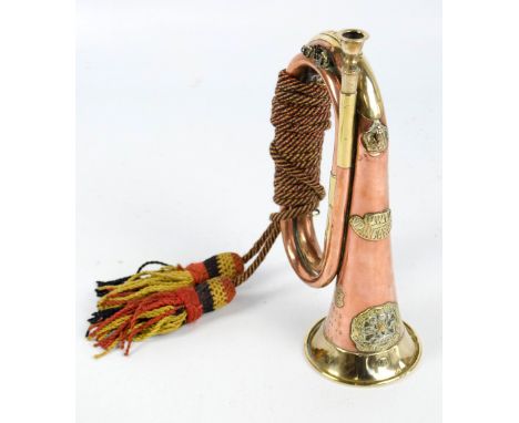 A WWI period copper and brass military issued bugle set with a plaque inscribed 'PWV S. Lancashire', also inscribed 'Mons Ais