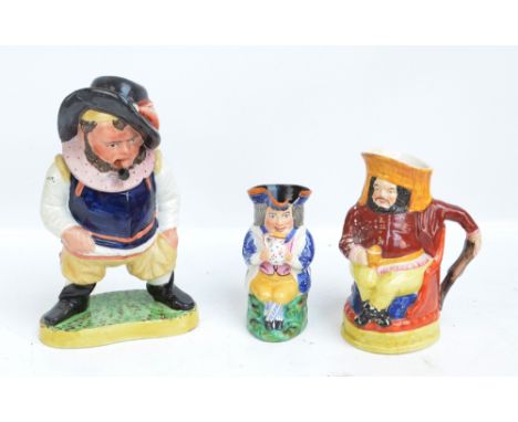A 19th century Staffordshire tobacco jar and cover modelled as a man standing with legs spread and smoking a pipe, height 31.