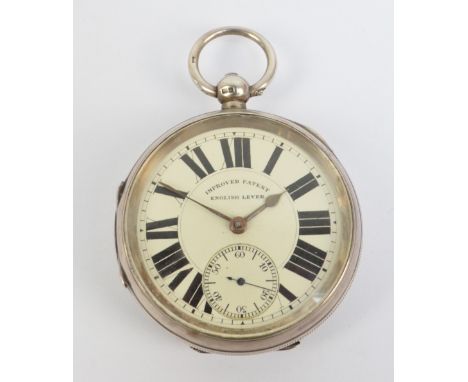 A silver English lever pocket watch circular white enamel dial set with Roman numerals with subsidiary seconds dial, hallmark