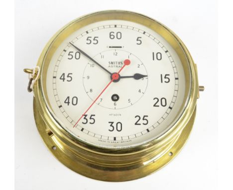 SMITHS; a brass cased Astral thirty hour ship's clock, the circular enamel dial set with Arabic numerals, diameter 22cm.   CO