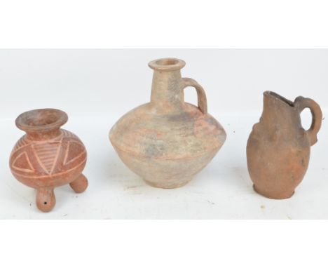 A Mayan three legged incised decorated pot, height 16.5cm, a further Mayan jug, height 20cm, both believed to be c.1300AD and