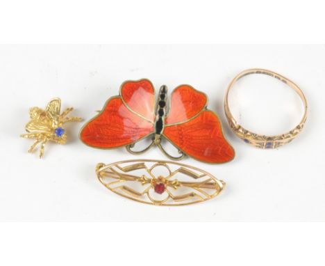 A 10ct pierced oval brooch, length 3.3cm, a small yellow metal inset brooch, a 9ct yellow gold dress ring (af), and a silver 