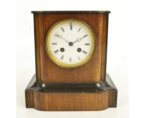 An Edwardian eight day mantel clock with ebonised detail, the circular enamel dial set with Roman numerals, height 22cm.