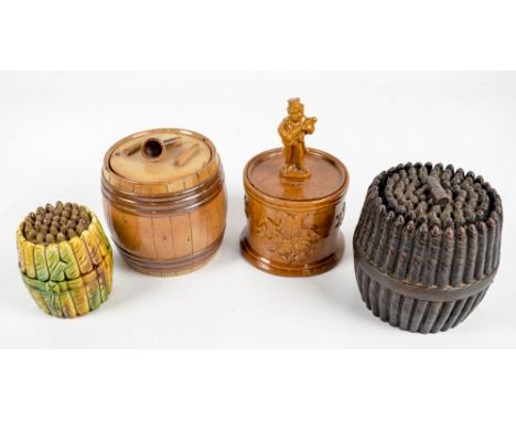 A late Victorian terracotta glazed tobacco jar and cover modelled as a band of vertical cigars, a further stoneware example w