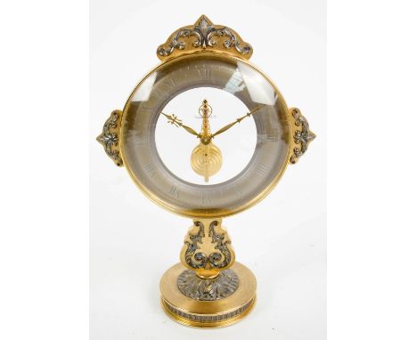 JAEGER-LECOULTRE; a gilt brass cast scroll decorated footed mantel clock, the circular brass glazed chapter ring set with Rom