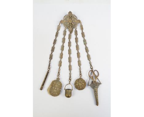 A 19th century pierced gilt metal chatelaine, with lozenge shaped clasp supporting five bars set with a pin cushion, scissors