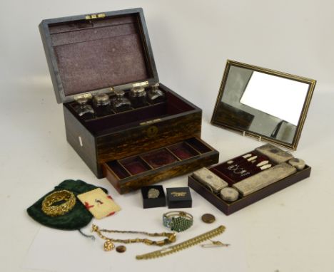 A 19th century coromandel vanity and work box, with mother of pearl cartouche, the hinged lid enclosing a fitted interior inc