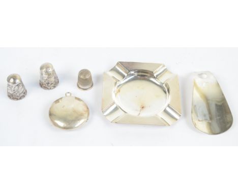 A small group of variously hallmarked silver items comprising a square engine turned decorated ashtray, D Bros, Birmingham 19