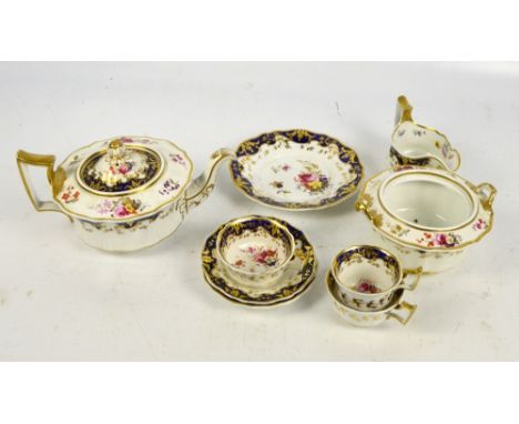 A 19th century porcelain floral decorated part tea set comprising a teapot, length 27cm, a sucrier (lacking cover), two cups 