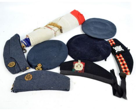 A collection of military berets, caps and bonnets, including The King's Own Scottish Borderers, Scot's Guards, the Royal Air 