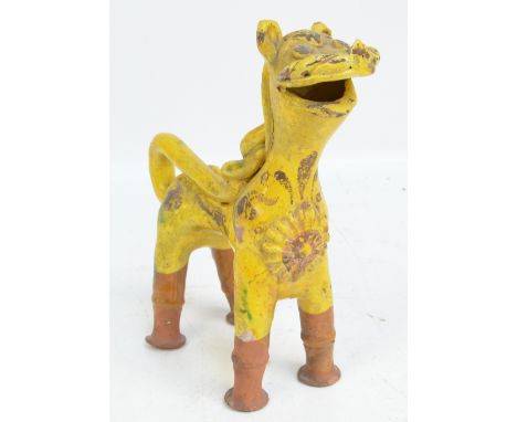 A 19th century Turkish Canakkale yellow and green gazed model of a stylised lion, height 23cm.   CONDITION REPORT:  Please se