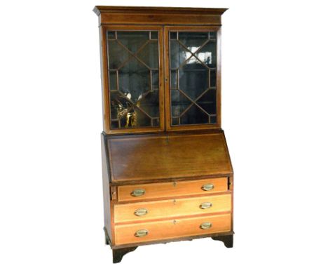 A large Edwardian mahogany bureau bookcase with crossband and string inlay, cornice top, two astragal glazed hinged doors enc