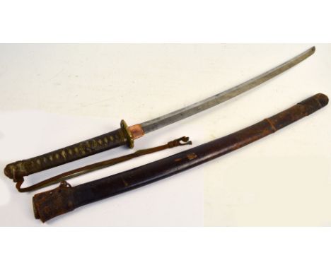 A Japanese katana with shagreen bound grip applied with a signed small silver button, floral decorated tsuba, length of blade