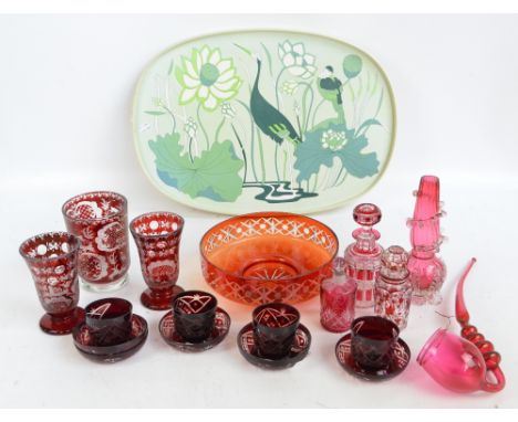 A quantity of ruby and cranberry tinted glass, predominantly late 19th/early 20th century Bohemian, including a cylindrical v