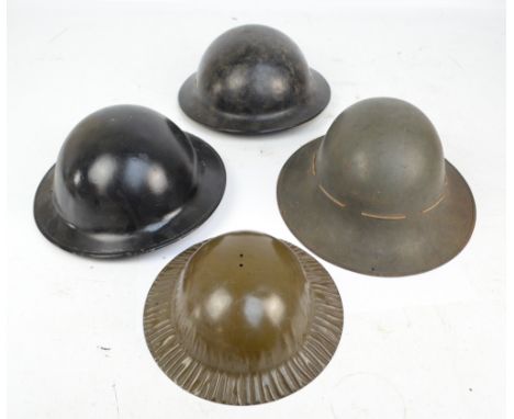 A WWII period helmet, a 'Plasfort' helmet, a further helmet and a child's helmet (4).