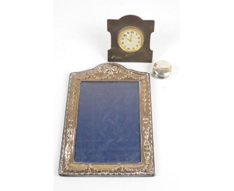 A BUCKLEY LTD; a George V hallmarked silver fronted engine turned decorated eight day travelling clock, the circular dial set