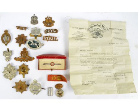 A quantity of military badges and cap badges including a Royal Corps of Signals cap badge, a Royal Army Service Corps cap bad