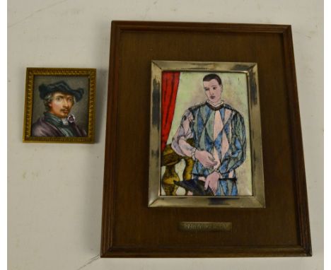 A framed enamel plaque with transferred reproduction of Harlequin after Pablo Picasso, with plaque inscribed 'To John Rigg fr