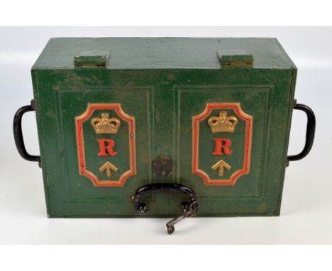A 19th century iron twin handled military strong box, the hinged lid relief moulded with crowned 'R', above a military broad 