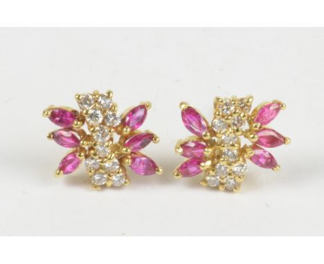 A pair of yellow metal diamond and ruby floral ear studs.