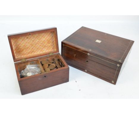 A late 19th century rosewood trinket box with mother of pearl inlay, the hinged lid enclosing a pull-out tray, width 30cm, an