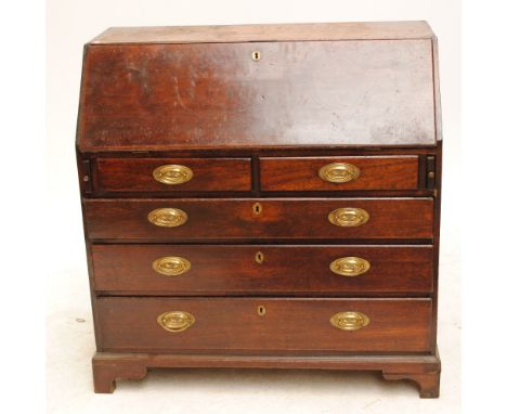 A George III mahogany bureau with fitted interior and two short above two long drawers on bracket feet, width 107cm.