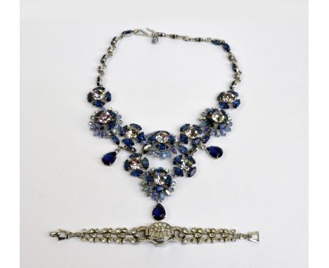 A Christian Dior floral blue and white rhinestone encrusted necklace with dark blue drops, marked '19 Chr Dior 58' with a lad