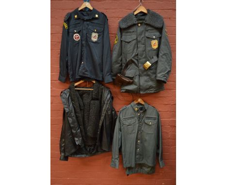 A Russian police summer uniform with button through shirt and trousers, and a Russian police patrol inspection service winter