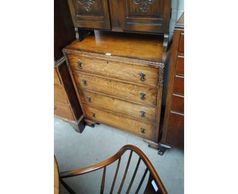 A 1930s oak chest four drawers raised on bracket feet, width 84cm, height 96cm.
