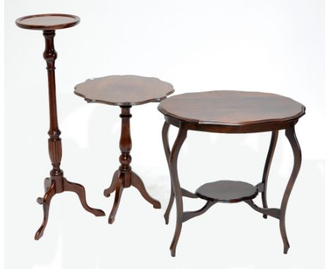 An oval mahogany two tier occasional table with shaped top, a square two tiered occasional table with drawer below lower shel