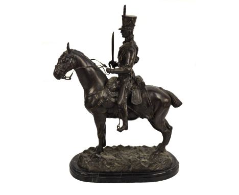 A large modern decorative bronze of a soldier upon horseback raised on an oval plinth, height 57cm.